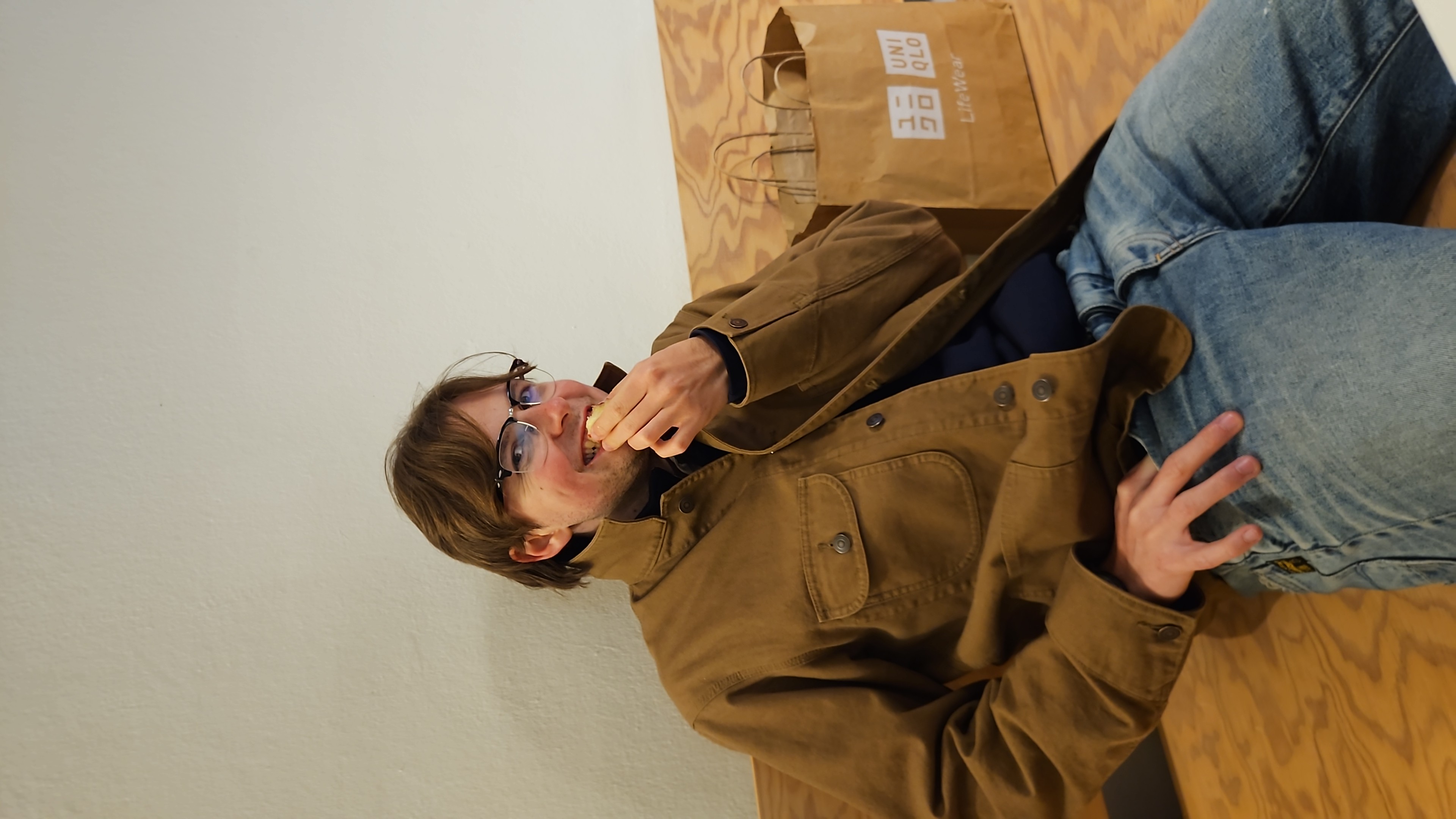 Santino Schrader looking funny at the camera while eating an apple